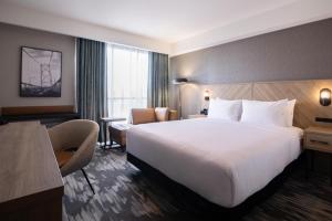Postelja oz. postelje v sobi nastanitve Sandman Signature Dartmouth Hotel & Suites