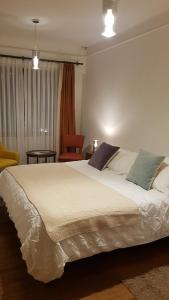 Cama ou camas em um quarto em Hostal Boutique Casa La Barca