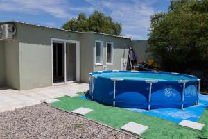 a pool in the yard of a house at Complejo Anacahuita in Carmelo