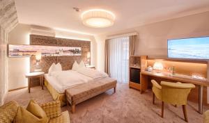 Posteľ alebo postele v izbe v ubytovaní Hotel Mader