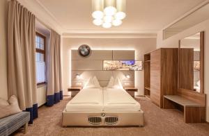 Posteľ alebo postele v izbe v ubytovaní Hotel Mader