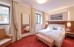 Posteľ alebo postele v izbe v ubytovaní Hotel Mader