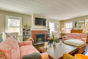 a living room with a couch and a fireplace at Historic Poughkeepsie Home Near Arlington & Vassar in Poughkeepsie