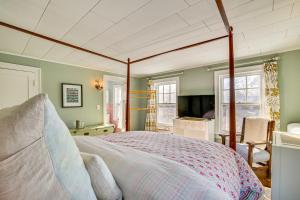 a bedroom with a large bed with a canopy at Historic Poughkeepsie Home Near Arlington & Vassar in Poughkeepsie