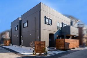 a house is shown with a building at Apartment Hotel 11 Villa Tengachaya in Osaka