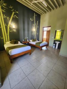 Postel nebo postele na pokoji v ubytování Hotel Plaza Queretaro + 17 fotografií