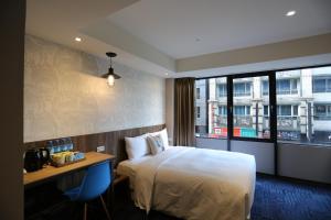 Postel nebo postele na pokoji v ubytování Ark Hotel - Changan Fuxing方舟商業股份有限公司