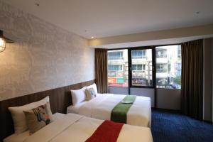 Postel nebo postele na pokoji v ubytování Ark Hotel - Changan Fuxing方舟商業股份有限公司 + 37 fotografií