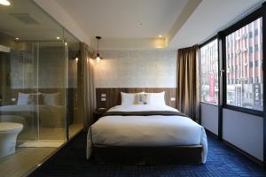 Postel nebo postele na pokoji v ubytování Ark Hotel - Changan Fuxing方舟商業股份有限公司