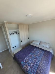 Ένα ή περισσότερα κρεβάτια σε δωμάτιο στο Apartamento en Valdivia Centro +1 φωτογραφίες