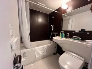 Koupelna v ubytování Hotel Route Inn Suzaka + 28 fotografií
