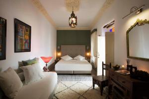 Ein Bett oder Betten in einem Zimmer der Unterkunft Riad Emotion
