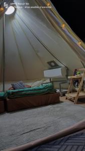 a bed in a tent in a room at ฤดูกาลเขาค้อ in Khao Kho