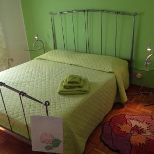 Ein Bett oder Betten in einem Zimmer der Unterkunft Le Ortensie di Via Rossetti