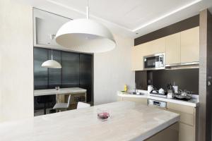 a kitchen with a large island in the middle at Hyatt House Shanghai Hongqiao CBD in Shanghai