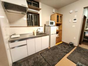 Dapur atau dapur kecil di BBQ 夏季プール マッサージチェア 舞子スノーリゾート 加賀屋旅館 南魚沼 Kagaya Ryokan 加贺屋旅馆