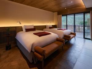 Postelja oz. postelje v sobi nastanitve Glamdy style hotel suite 山ノ麓