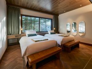 Postel nebo postele na pokoji v ubytování Glamdy style hotel suite 山ノ麓
