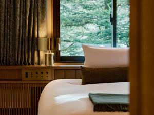 Postelja oz. postelje v sobi nastanitve Glamdy style hotel suite 山ノ麓