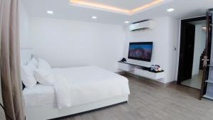 TV a/nebo společenská místnost v ubytování Noden Hotel & Apartment