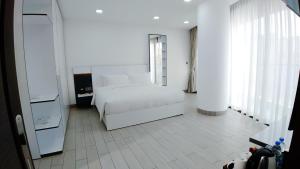 Postel nebo postele na pokoji v ubytování Noden Hotel & Apartment