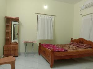 Letto o letti in una camera di Chandru Residency