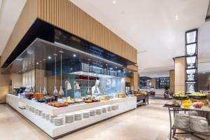 a buffet in a restaurant with a lot of food at Hyatt House Shanghai Hongqiao CBD in Shanghai