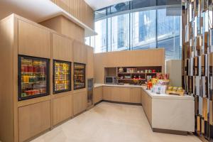 a large kitchen with a counter in a building at Hyatt House Shanghai Hongqiao CBD in Shanghai