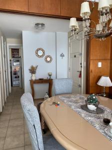 a dining room with a table and chairs at Olimpo Apartment 6 Frente al mar-Plaza Colon solo familias! in Mar del Plata +26 photos