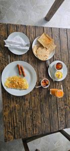 a table with plates of breakfast food on it at Lake & Ocean Villa ahangama in Elagawagoda