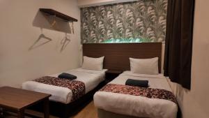 Postel nebo postele na pokoji v ubytování Highlanders Hotel
