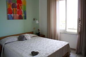 Postel nebo postele na pokoji v ubytování Hotel Holiday Bambù