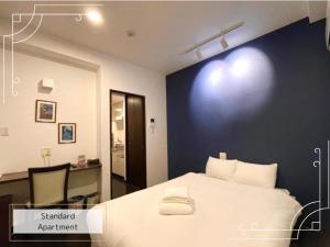 Una cama o camas en una habitación de Luana Uakoko Resort 旧 EmiFull Resort