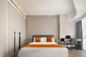 Ліжко або ліжка в номері Dayu Apartment Century City Branch