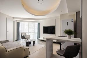 Телевізор і / або розважальний центр в Dayu Apartment Century City Branch