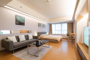 Телевізор і / або розважальний центр в Dayu Apartment Century City Branch
