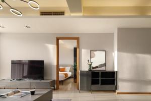 Телевізор і / або розважальний центр в Dayu Apartment Century City Branch