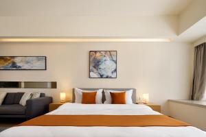 Ліжко або ліжка в номері Dayu Apartment Century City Branch