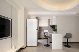 Телевізор і / або розважальний центр в Dayu Apartment Century City Branch