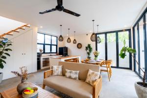 a living room with a couch and a table at Villa Hati 2 in Canggu