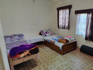 Postel nebo postele na pokoji v ubytování MANOAH Homestay