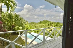 a balcony with a view of the ocean at Villa Valentine LomaBonitaLasTerrenas in Las Terrenas