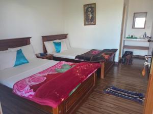 Postel nebo postele na pokoji v ubytování Kadalla Cottage