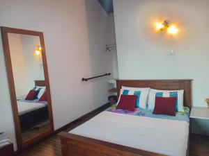 Postel nebo postele na pokoji v ubytování Kadalla Cottage