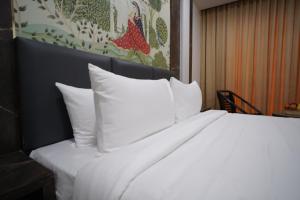 Hotel Sastha Grand客房内的一张或多张床位