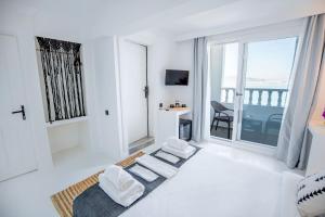 Postel nebo postele na pokoji v ubytování Çamlık 87 Hotel Ayvalık