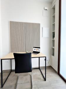 a desk with a chair in a room at Encanto Rural en Requena in Requena +33 photos