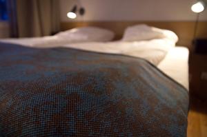 Postel nebo postele na pokoji v ubytování Hamarøy Hotel