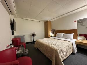 Postel nebo postele na pokoji v ubytování Chian Huei Business Hotel
