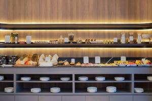 a buffet of food on display in a restaurant at NH Collection Buenos Aires Jousten in Buenos Aires